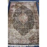 A Nain ivory ground rug 185 x 125cm