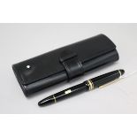 A Montblanc Meisterstuck black lacquered fountain pen, 14K gold nib, mint, in original leather pouch