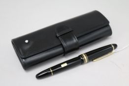 A Montblanc Meisterstuck black lacquered fountain pen, 14K gold nib, mint, in original leather pouch