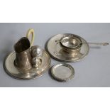 A German 800 tea strainer and stand, a German silver milk jug, a pair of Austrian circular stands, a