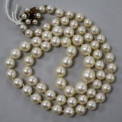 A single strand cultured pearl necklace with sapphire set 9ct gold clasp, 50cm.