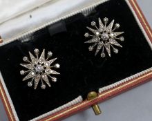 A pair of 9ct gold and diamond set starburst earrings, diameter 17mm.