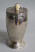 An Art Deco silver sugar caster with ivory knop, Josiah Williams & Co, London, 1934, height 13.