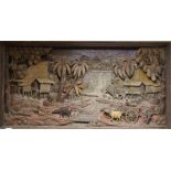 A Thai carved wood panel, depicting farmers in a landscape