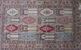 A Persian silk rug 113cm x 70cm