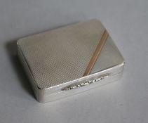 A modern engine turned silver and rose gold pill box by Peter John Doherty, Birmingham, 1993, 45mm.