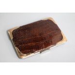 An Edwardian 9ct gold mounted crocodile skin wallet, 14.3cm