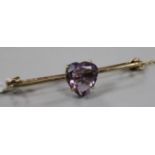 A yellow metal and heart shaped amethyst set bar brooch, 49mm.