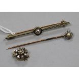 A yellow metal and diamond set bar brooch, a stick pin, and a rose cut diamond set clasp.