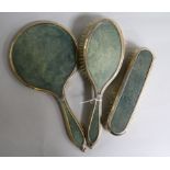 A George V silver and shagreen mounted three piece mirror and brush set by Charles & Richard Comyns,