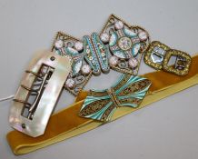 Two micro mosaic belt buckles, two other buckles and a mother of pearl buckle.