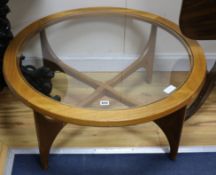 A teak and glass 1950s coffee table W.87cm