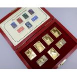 Two silver gilt replica stamp sets, 25th annivesary Queen Elizabeth II and The Empire Collection,