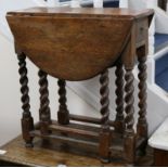 A small early 18th century oak oval topped gate leg table W.64cm