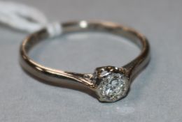 An 18ct white gold and solitaire diamond ring, size P.