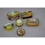 A small collection of enamel patch boxes and other boxes