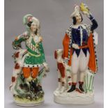 Two 19th century Staffordshire figures, Theatre or Fairground subject H 37.5cms