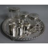 Five silver napkin rings, various, three silver-mounted toilet bottles, a plated tray and pair of