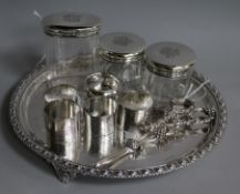 Five silver napkin rings, various, three silver-mounted toilet bottles, a plated tray and pair of