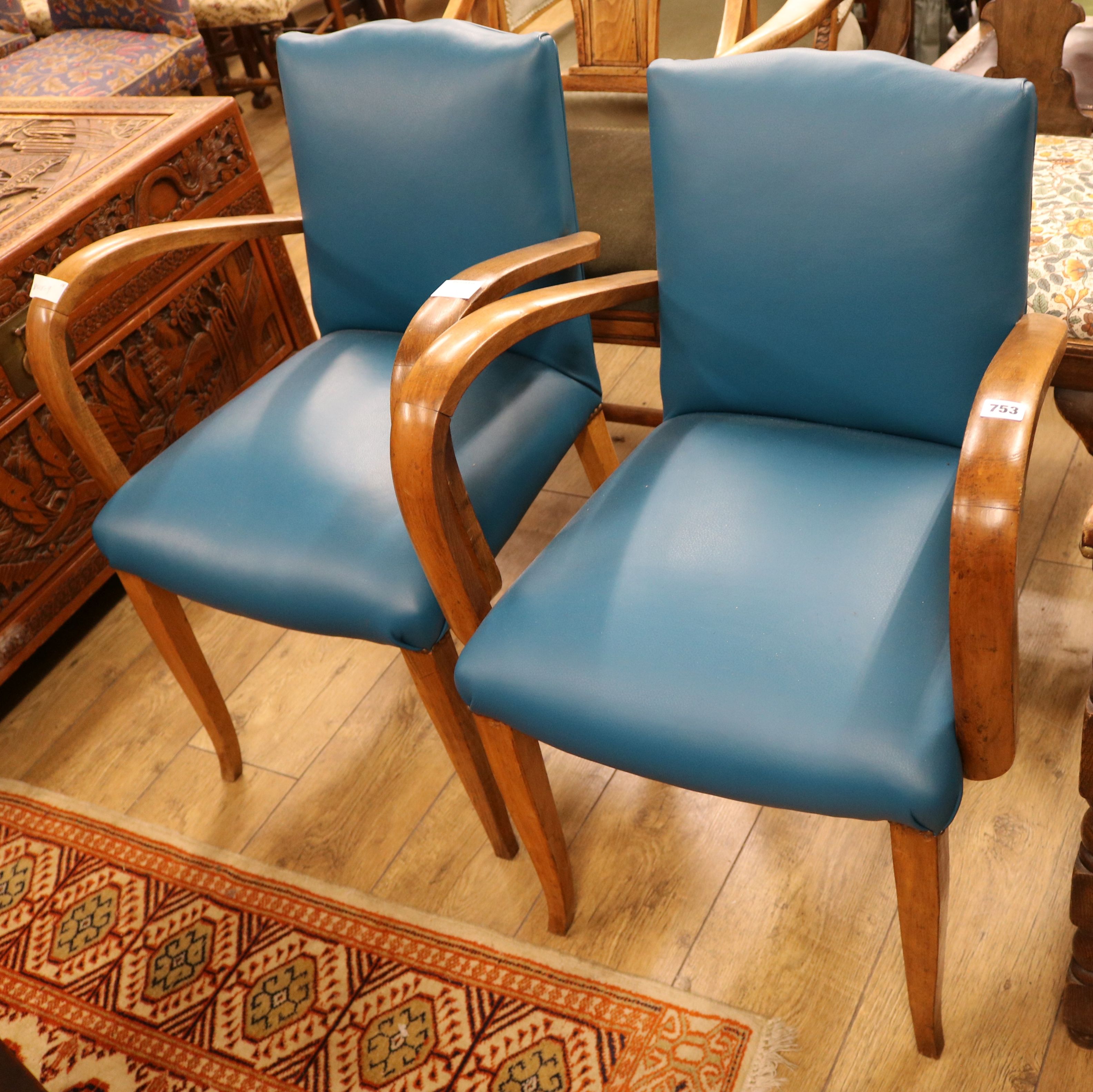 A pair of leather French chairs