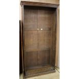 A tall oak open fronted bookcase W.110cm