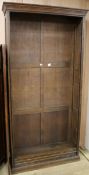 A tall oak open fronted bookcase W.110cm