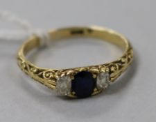 An 18ct gold sapphire and diamond three stone ring, size Q.