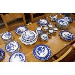 An Old Willow pattern Doulton dinner service