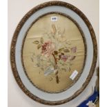 A silk embroidered circular floral panel