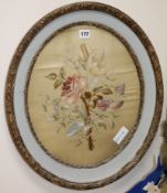 A silk embroidered circular floral panel