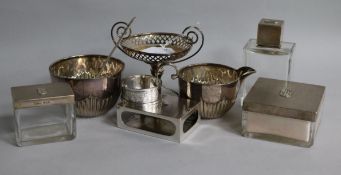 A quantity of assorted silver items including Asprey toilet jars, sugar bowl, cream jug and bonbon