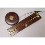 A Dr Bate's mahogany and brass clinometer and Chesterman tape measure