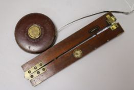 A Dr Bate's mahogany and brass clinometer and Chesterman tape measure