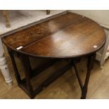 An oak gateleg table W.107cm