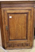 A late 18th century oak corner cupboard W.81cm