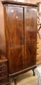 An early 19th century Biedermeier mahogany standing corner cupboard W.95cm