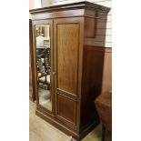 An Edwardian banded mahogany 2 door wardrobe W.118cm