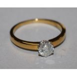 A diamond solitaire ring, 18ct gold shank (the stone 0.59ct), size S.