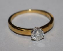 A diamond solitaire ring, 18ct gold shank (the stone 0.59ct), size S.