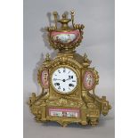 A gilt and ceramic clock H.35cm