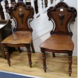A pair of Victorian hall chairs