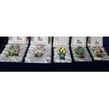 Four Halcyon Days porcelain 'bunch of flowers' desk seals and a scent bottle (all boxed)