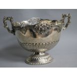 A demi fluted white metal two handled oval pedestal bowl, 26cm over handles.