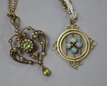 An Edwardian 9ct gold, seed pear and peridot pendant on a 9ct gold chain and one other 9ct gold
