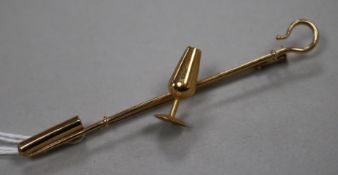 A yellow tie pin modelled as a crook with wine glass in 'Oro de Ley' box, 71mm.