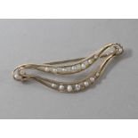 A 14ct gold and cultured pearl set brooch, 56mm.