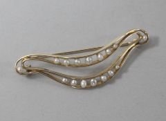 A 14ct gold and cultured pearl set brooch, 56mm.