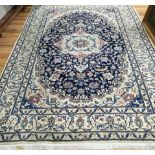 A Nain silk inlaid carpet, 295cm x 200cm.