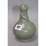 A Chinese celadon bottle vase H.15cm