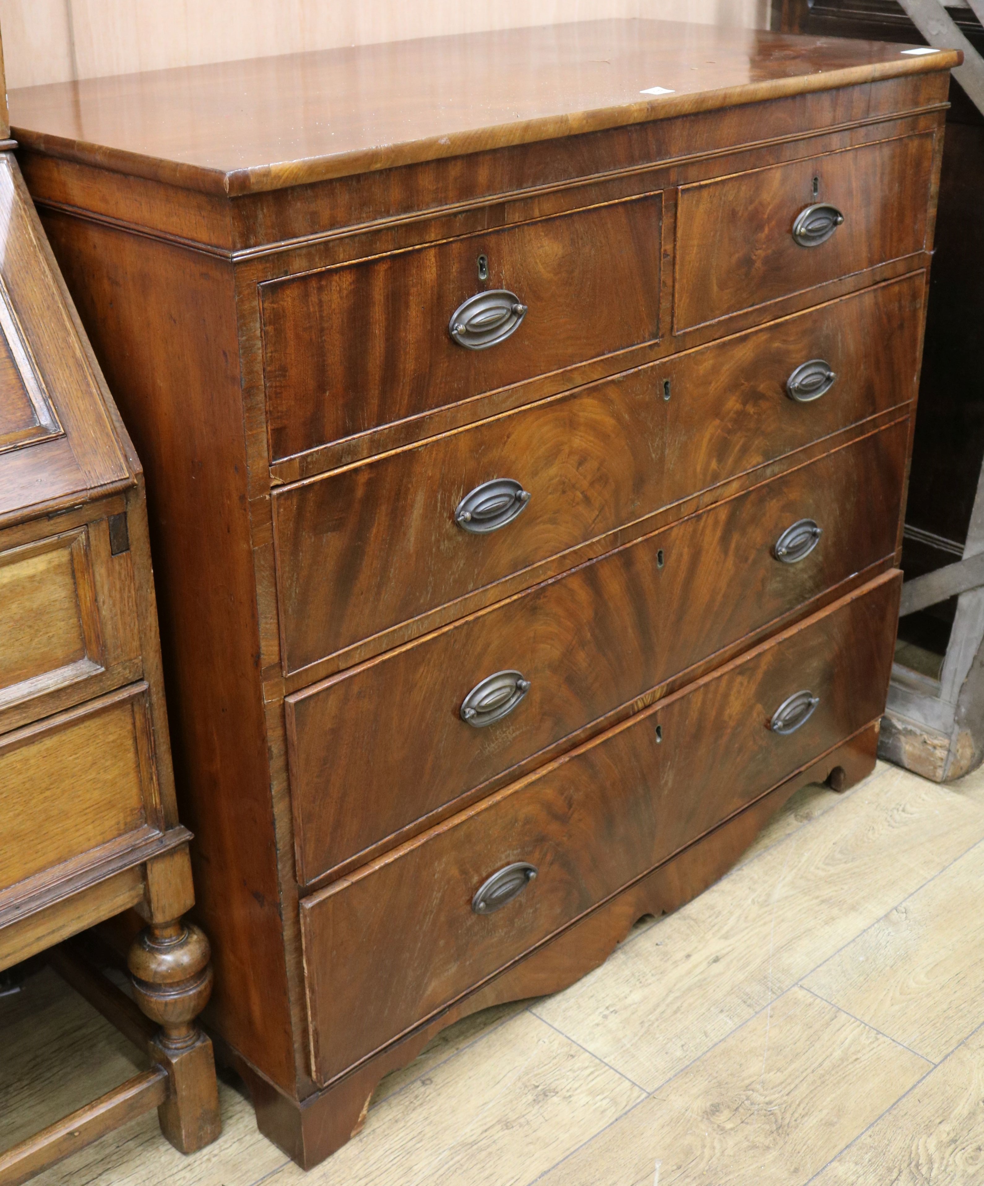 A Regency mahogany chest of two short and three long drawers, W.109cm